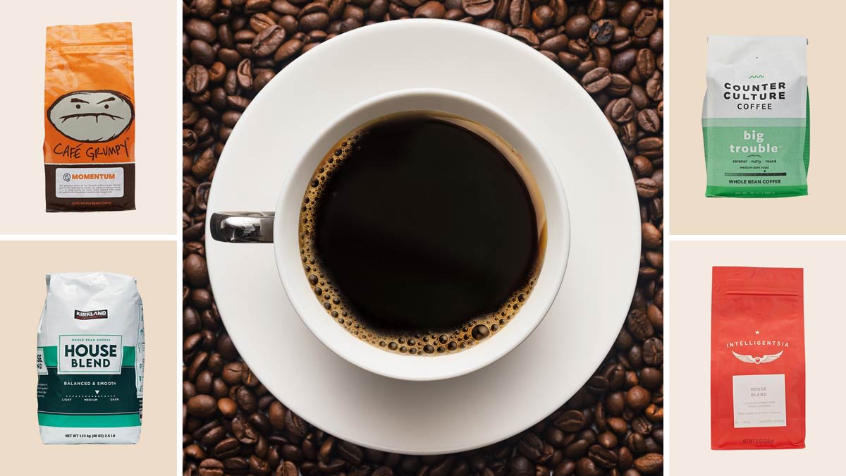 Cup of black coffee surrounded by Café Grumpy, Kirkland, Counter Culture, and Intelligentsia coffee bags.