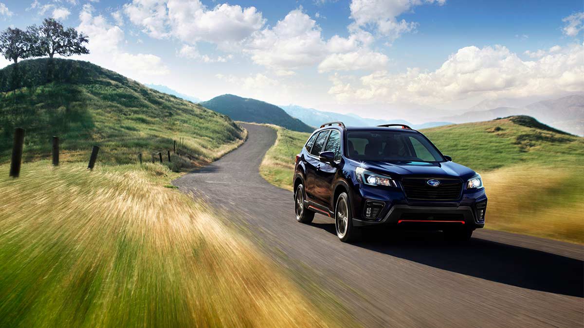 2020 Subaru Forester driving down a country road.
