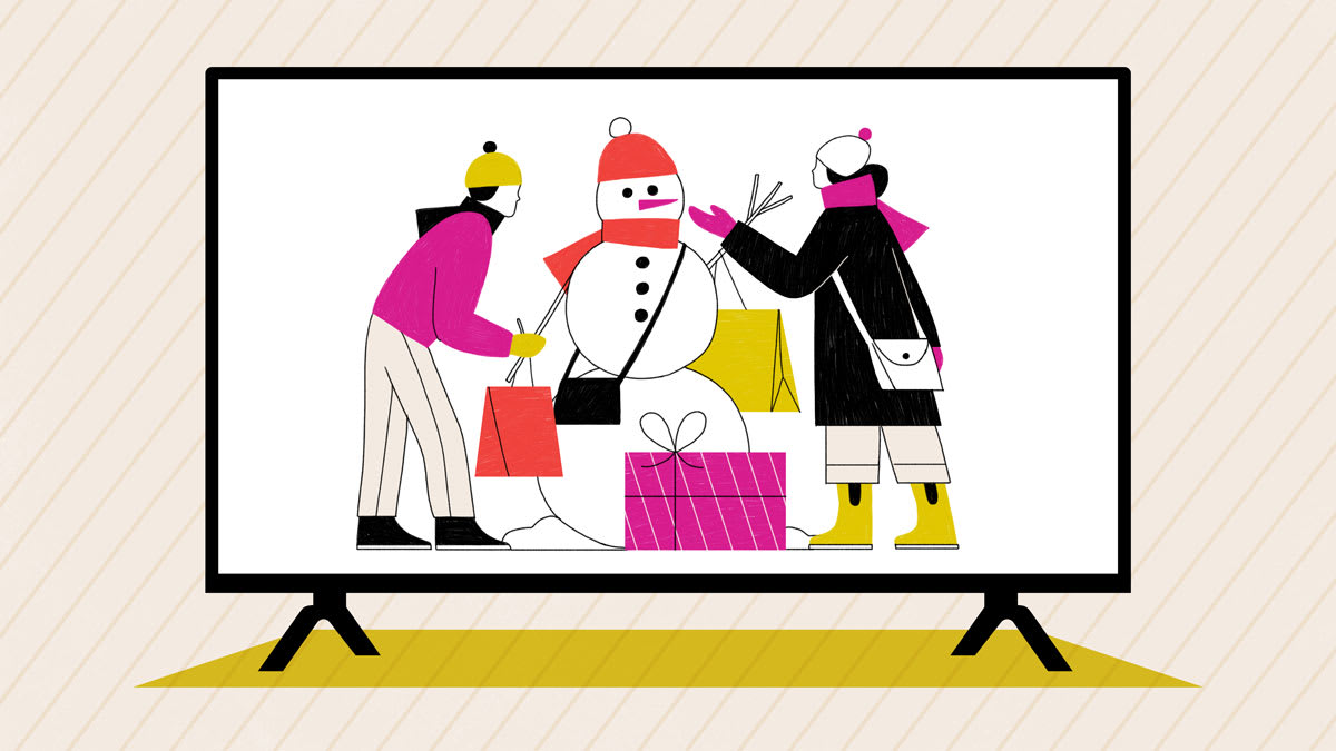 Two people building a snowman with shopping bags and gifts, shown on a large television screen.