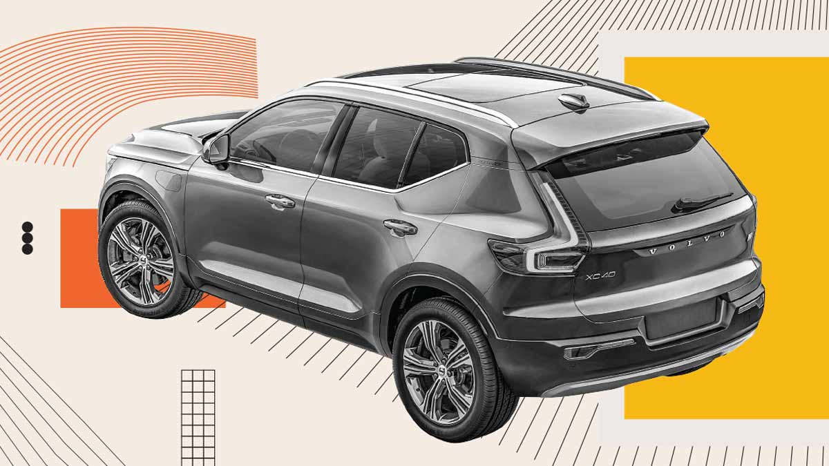 A grey SUV is shown from the rear three-quarter view with abstract graphic elements.