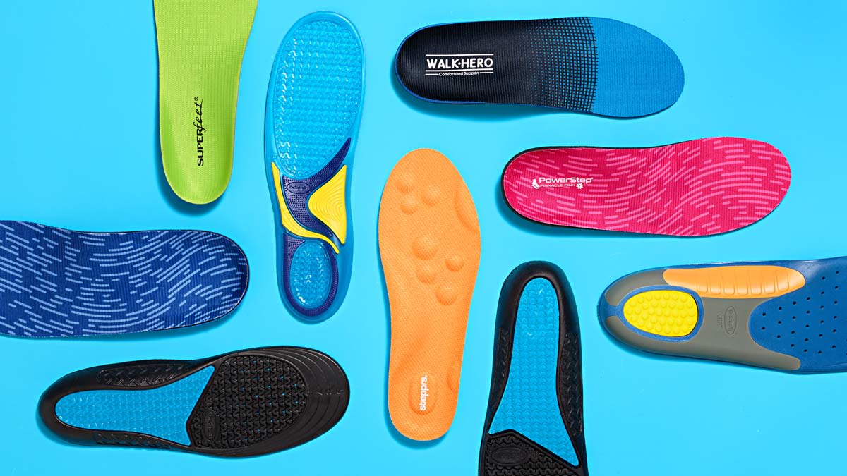 overhead view of 9 different shoe inserts on light blue background