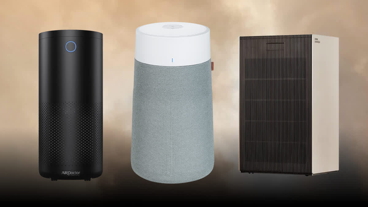 Airdoctor 4000 Black, Blueair Blue Pure 311i+ Max, and Coway Airmega ProX air purifiers with smoke in background