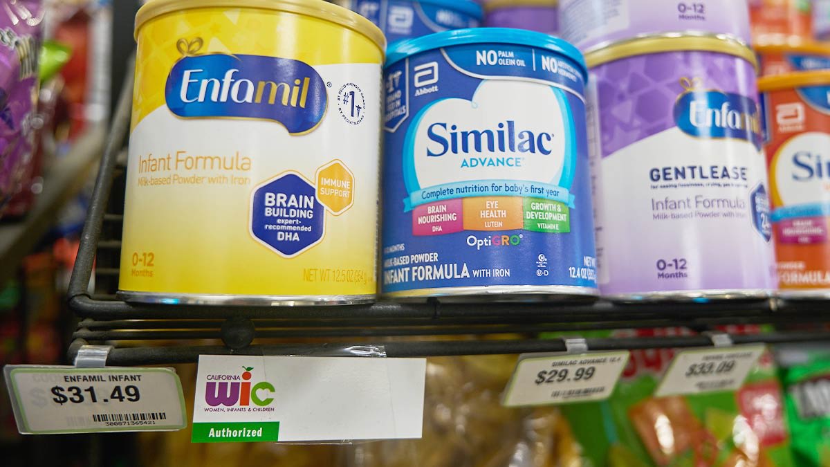 Infant formula cans eligible for WIC and advertised as purchasable with EBT funds (Electronic Benefit Transfer) are sold at a market in Los Angeles.