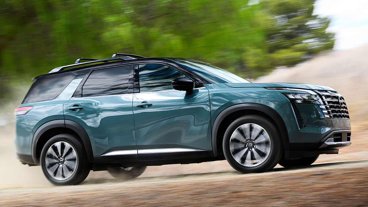 2026 Nissan Pathfinder driving up a dirt road