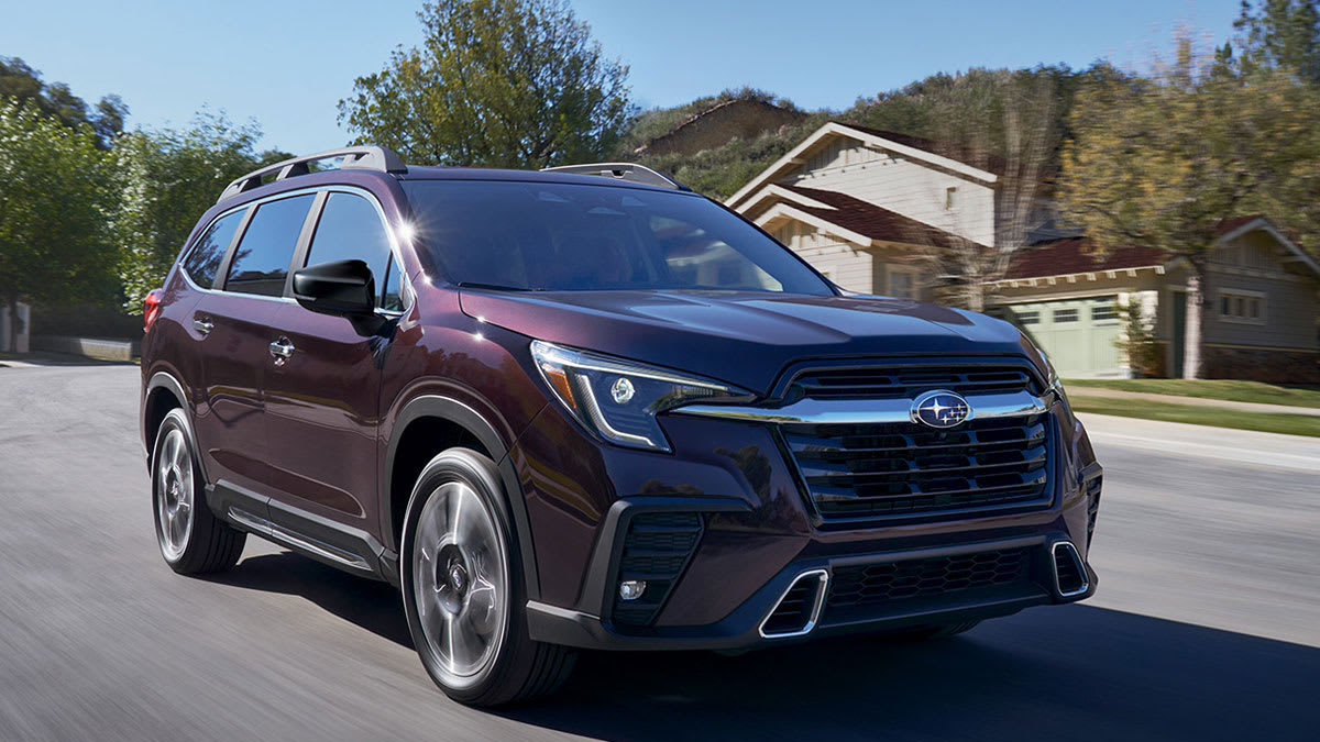 2026 Subaru Ascent driving through a neighborhood
