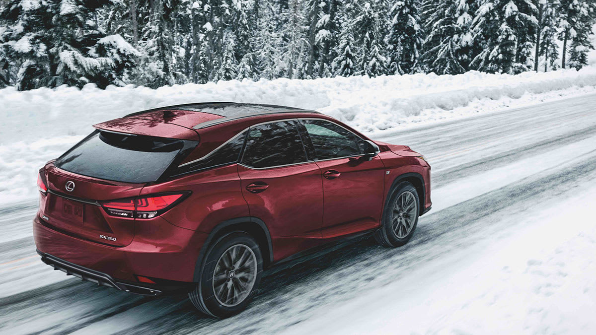 2021 Lexus RX 350 driving on a snow-covered road underscores the important of good tires.