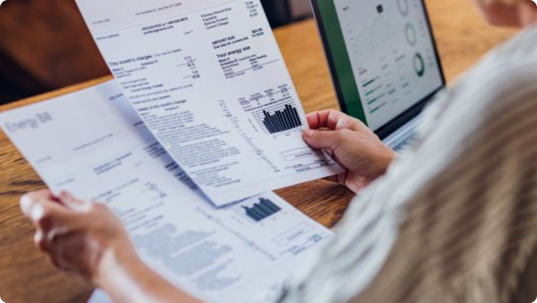 Person looking through their energy bill.