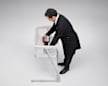 Consumer Reports Test Program Leader, Product Safety and Sustainability Juan Alberto Arguello Garcia Pertusa demonstrating a Head-to-Toe Sleep Surface Angle test by placing Hinge Gauge and Inclinometer in a cantilevered bassinet.