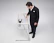 Consumer Reports Test Program Leader, Product Safety and Sustainability Juan Alberto Arguello Garcia Pertusa demonstrating a Lateral Sleep Surface Angle Weighted Test by placing Hinge Gauge and Inclinometer in a cantilevered bassinet.