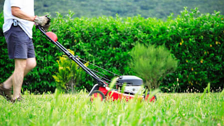 Person mowing their lawn.