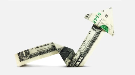 401K money concept showing a rising arrow made out of a dollar