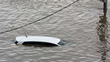 car submerged in flood water
