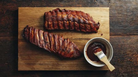 rack of ribs on a cutting board