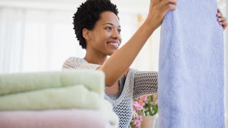 Person folding towels