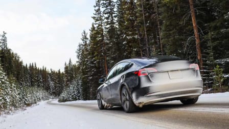 Tesla, an EV driving in the winter