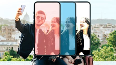 Young couple taking a selfie during golden hour in the Giardino degli Aranci in Rome, Italy