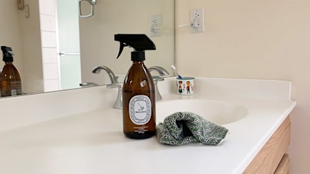 A bottle of Diptyque cleaning spray on a bathroom counter.