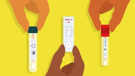 Hands holding 3 negative covid tests