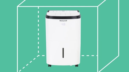 Honeywell TP70WKN Dehumidifier with cubic footage graphic behind it