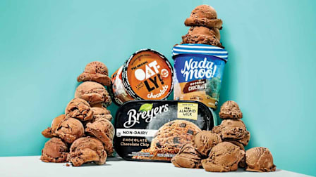 tower of dairy-free ice cream scoops with three different product containers