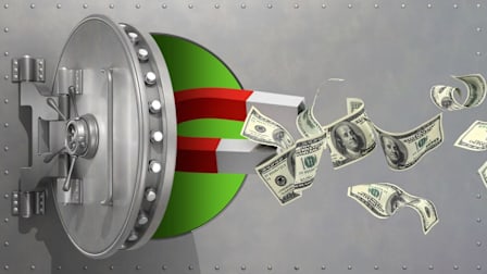 Vault with magnet attracting hundred dollar bills