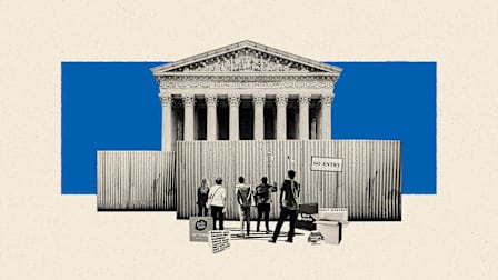 A crowd of people with their meal delivery kit boxes standing in front a court with a fence in front of it.