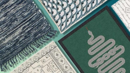 green, blue, and white patterned rugs on a green background