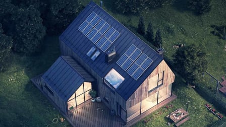 Bird's eye view of a home at dusk that has solar panels on its roof.