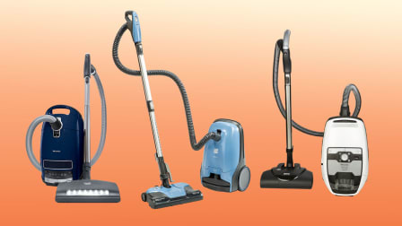 Three canister vacuums pictured on colored background