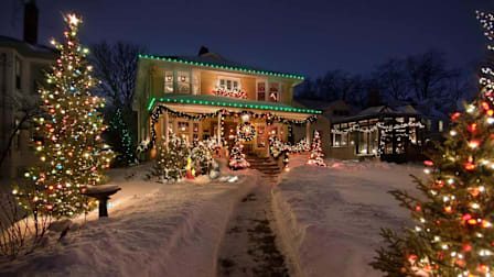 a house at night during winter with holiday lights turned on