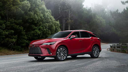 red 2024 Lexus RX SUV on country road with woods in background