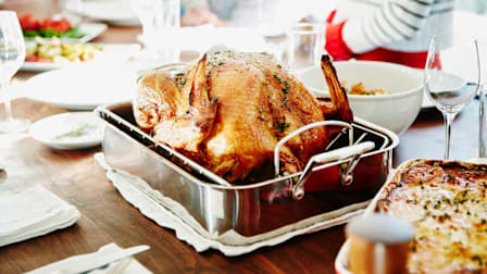 a cooked turkey on a dining table