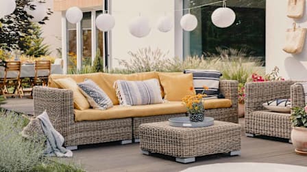 outdoor seating area on a deck in a backyard
