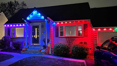 Groove Permanent Lights displayed on a home at night.