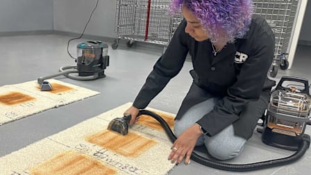 CR tech testing a portable carpet cleaner