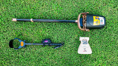 Arm & Hammer, Dog Buddy, and Pooch Approved poop scoopers on grass