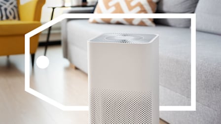 An air purifier in a living room surround by a deals tag graphic.