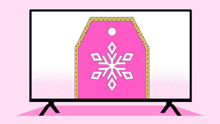 A TV displaying a pink price tag with a white snowflake design in the center and a gold-trimmed border, set against a light pink background