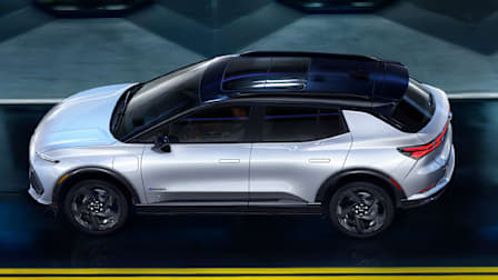 2025 Chevrolet Equinox EV 3RS driving, side at night