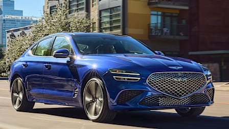 2025 Genesis G70 driving in a city