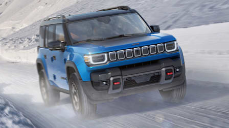 2026 Jeep Recon Electric SUV driving on a snowy road
