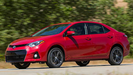2014 Toyota Corolla driving on a road.