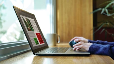 Closeup of an LG Gram Pro 17" (2024) laptop being used by a person on a desk.