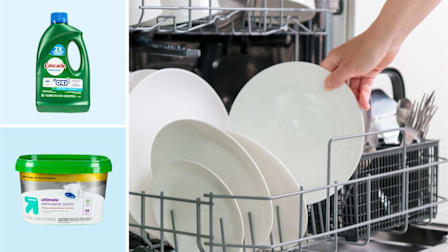 Cascade Complete + Oxi Dawn. Up & Up (Target) Ultimate Dishwasher Packs alongside a person unloading clean white plates from a dishwasher rack.