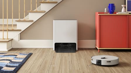 Samsung Jet Bot VR7MD96514G in hallway with stairs and dresser in background