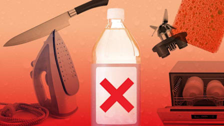 A bottle of vinegar with a red "X" on its label, surrounded by a knife, iron, sponge, blender blade, and dishwasher
