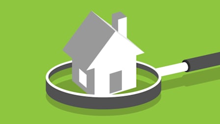 illustration of a magnifying glass around a house.