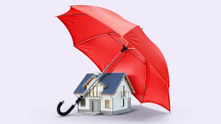 A house being protected by a red umbrella.