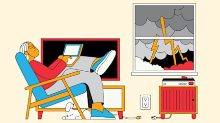 An individual relaxes on a chair with a laptop during a storm. The TV and Stereo are unplugged.