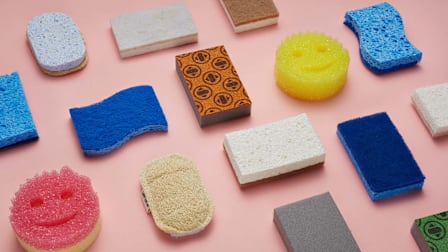 different types of sponges on a pink background